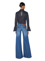 Jeans a zampa con taschini