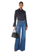 Jeans a zampa con taschini